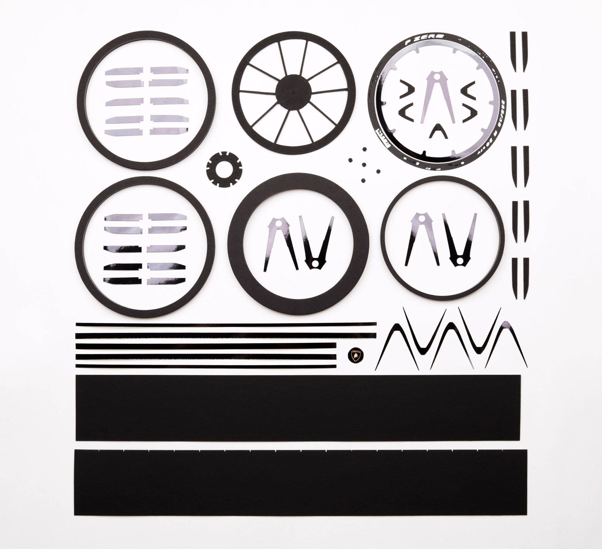 All the parts for one wheel - about 65 in total. The parts are a mix of cardboard, foam core board, and foil board. I create plans for each part in Adobe Illustrator as usual.