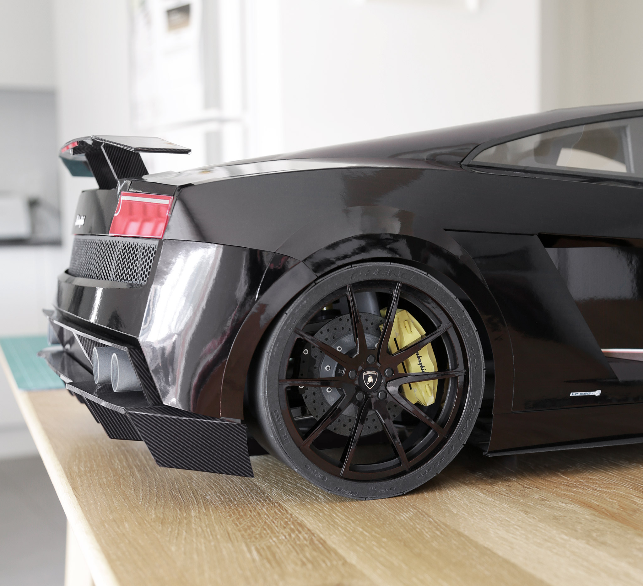 A close up of one of the all-black Strasse SV5 forged monoblock wheels I'd built for the Gallardo.