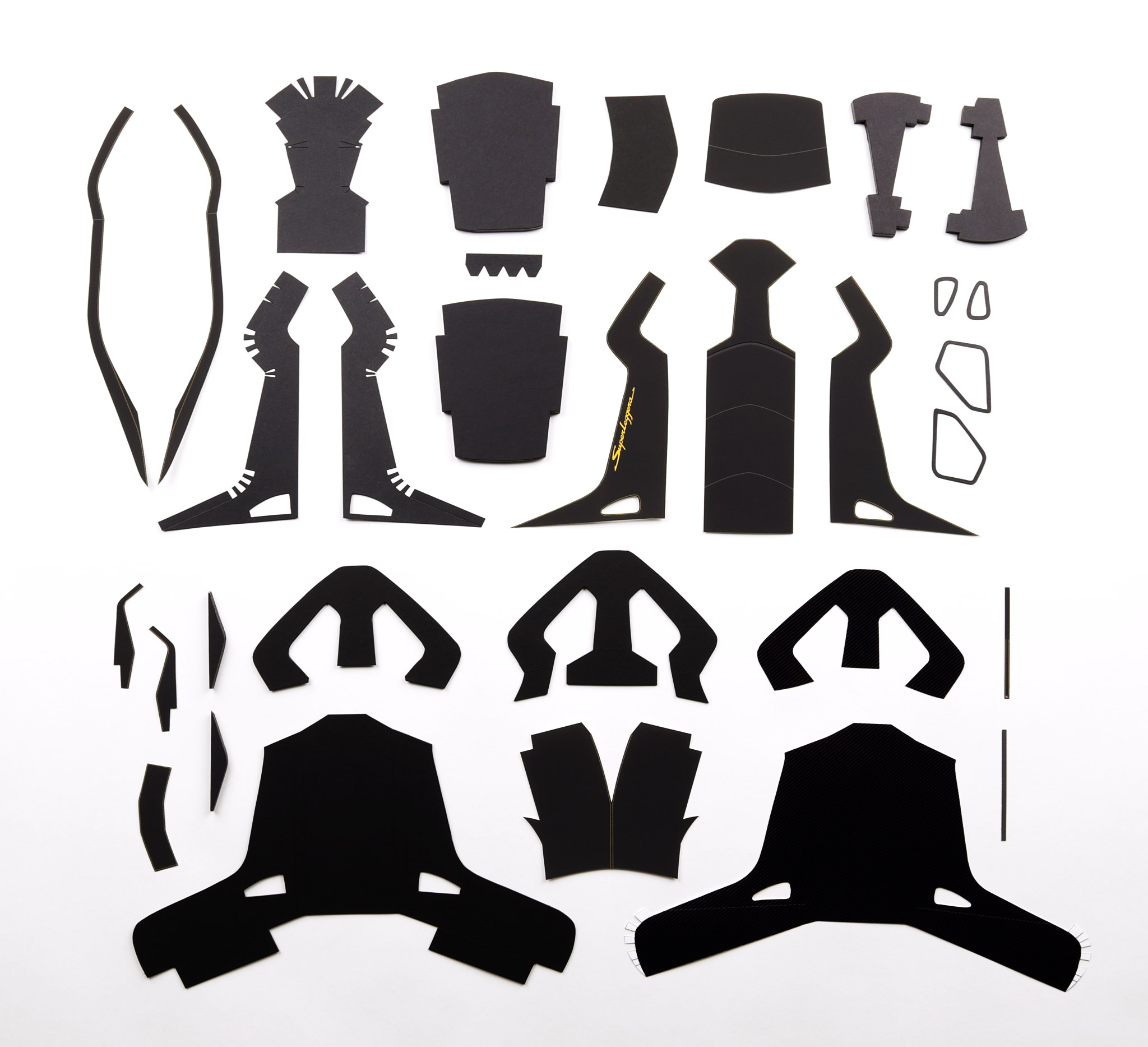 All the parts I have designed for one of the two front seats. Each seat consists of 32 individual pieces. Each piece is either foam core board; 1000gsm poster board; light card; or printed photo paper.