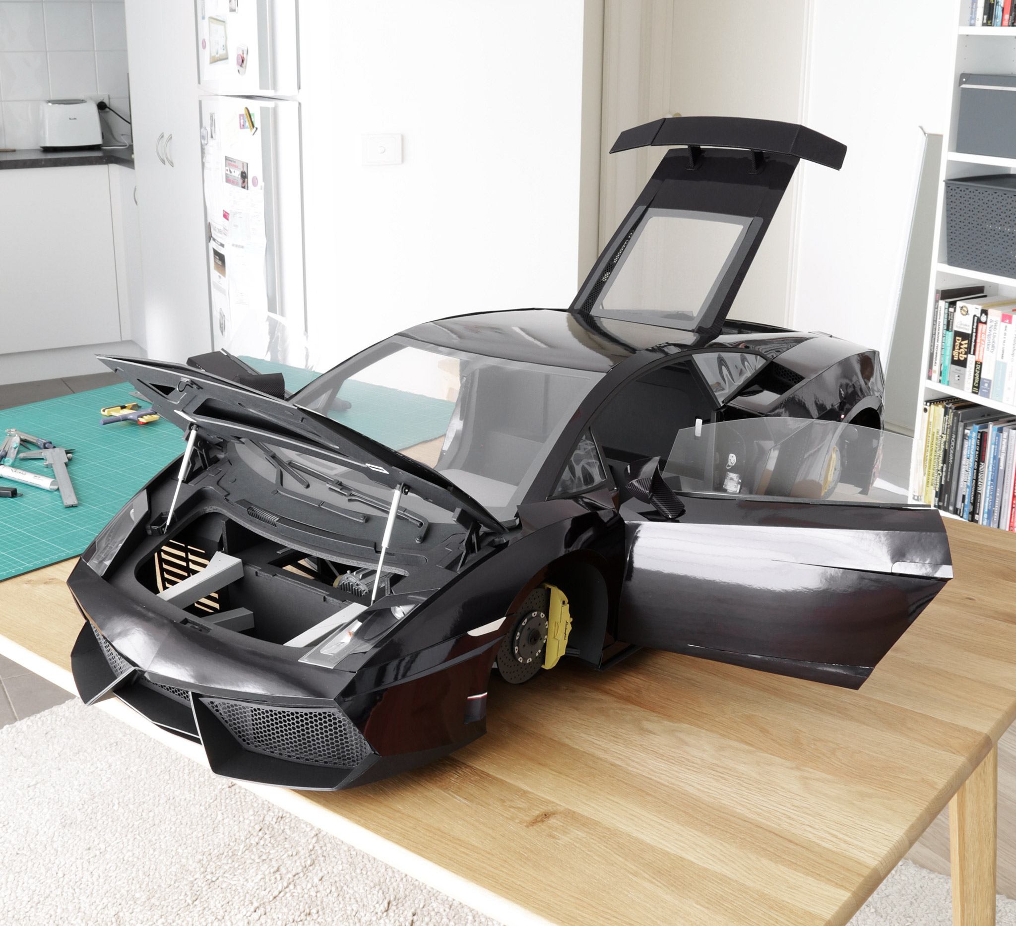 Another view of the completed body. The front trunk lid, doors, and engine cover all open and close, just like the real car.