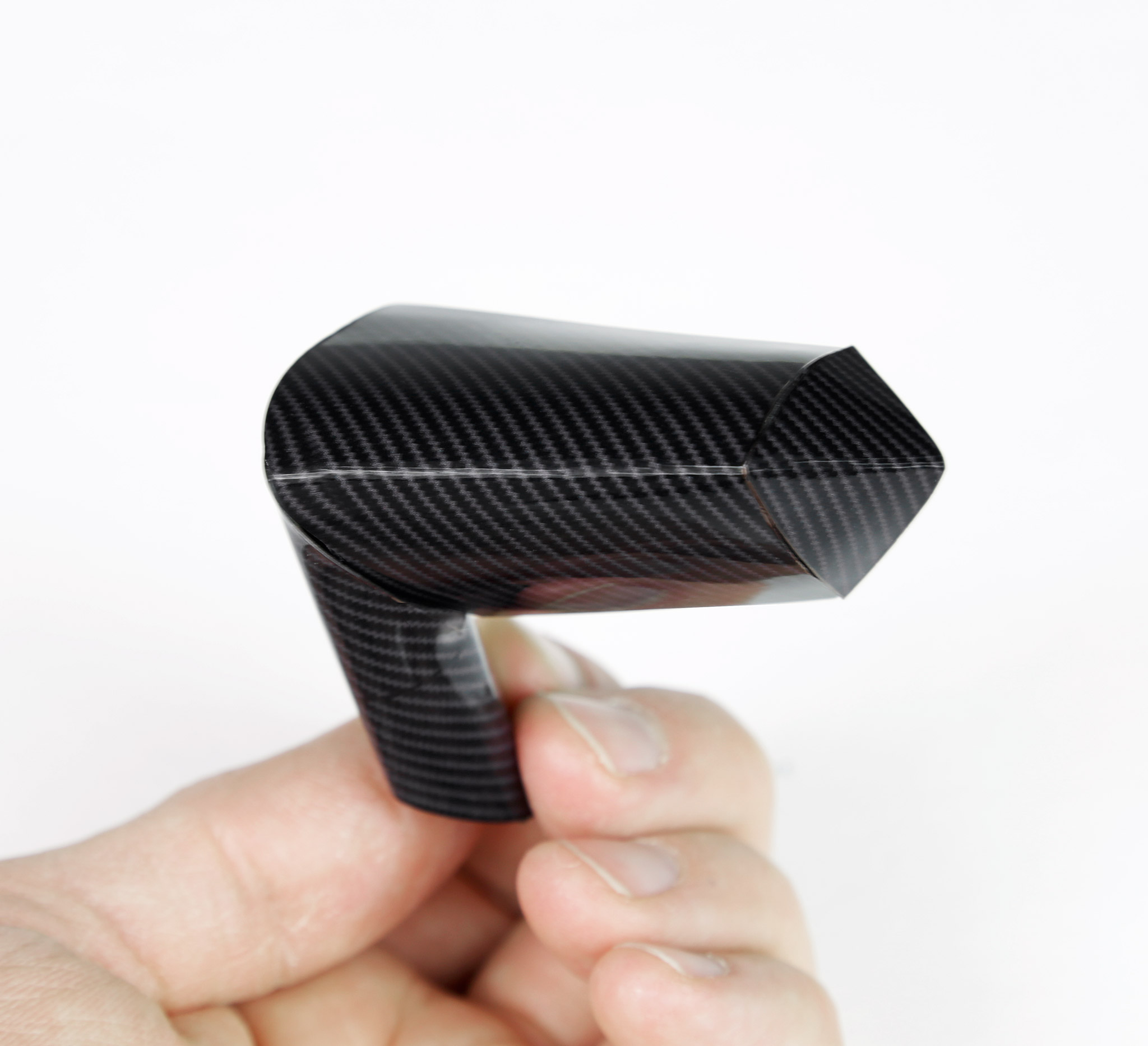 Driver side door mirror, ready to be fitted. Each door mirror consists of 12 parts, all cut by hand. I made a carbon-fire texture in Illustrator, and printed the parts on gloss photo paper.